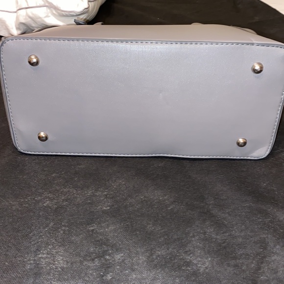 Purse with bow design on front. Brand new with tag. Gray purse. - Picture 12 of 16